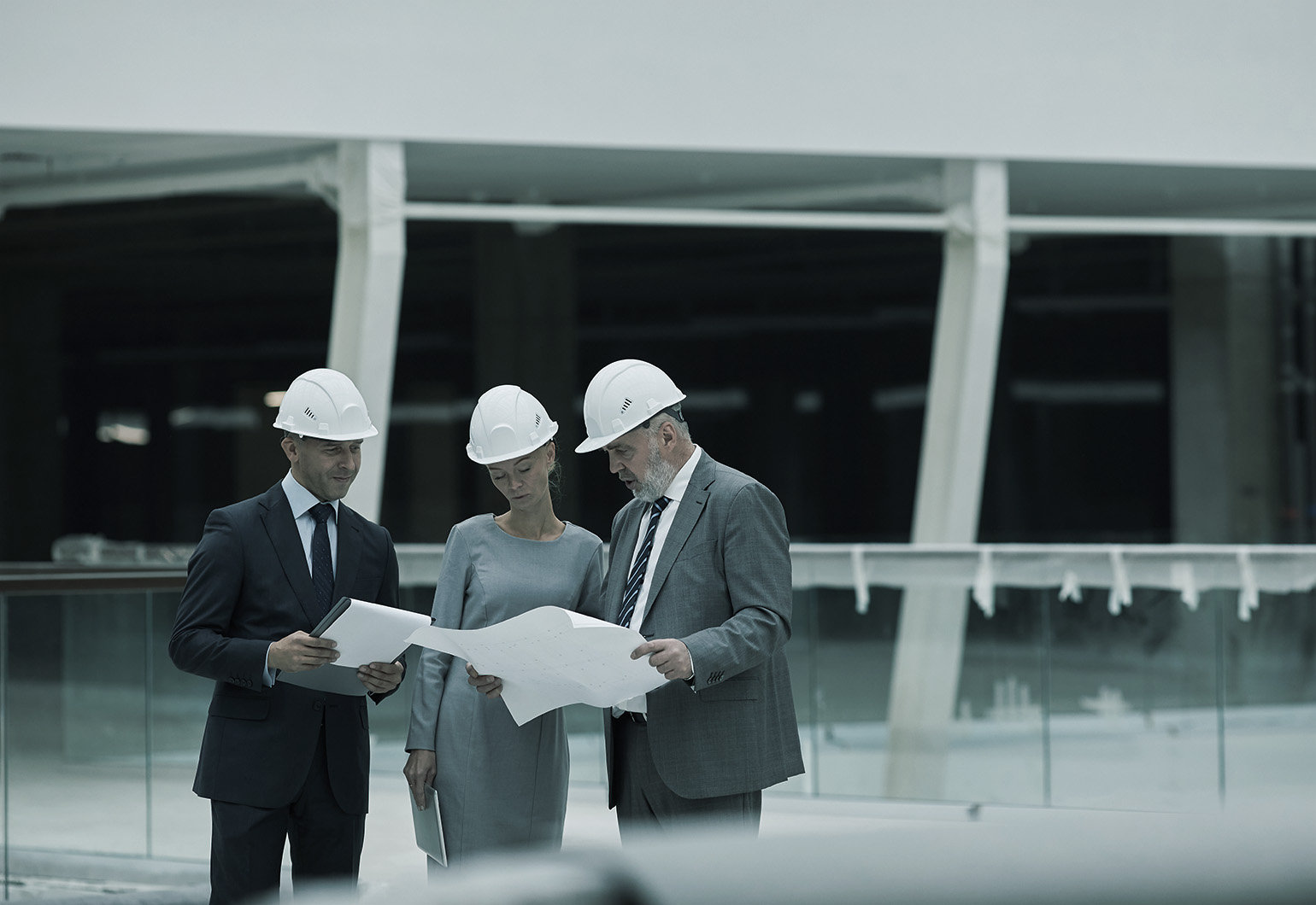 Commercial agent meeting with clients on construction site